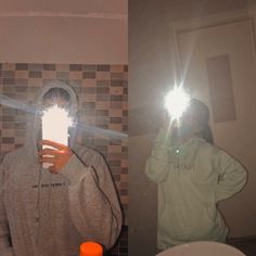 a person taking a selfie in front of a mirror with their light shining on them