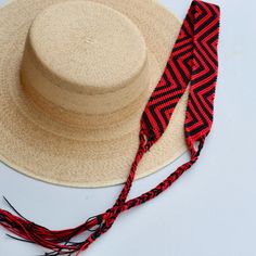 These Beautiful hat bands are carefully  hand woven by Rosa in Chiapas,Mexico. Each band showcases a unique and colorful patterned design using traditional macrame techniques.  Add a touch of handmade artistry to your hat collection  today! - Width 1 3/4"  - Length: 23 inches, not including fringe - Fringe 10" each side   - Fits most hats - Polyester yarn  - All items are shipped from US. All Mi Mundo Mexicano items are 100% handmade by artisans in Mexico. Each stitch and item is completely unique and one-of-a-kind, so you'll never find two that are exactly the same! * Your Purchase supports artisans craft and families ! Adjustable Red Flat Brim Straw Hat, Handwoven Natural Hat Band With Flat Brim, Handwoven Adjustable Hat With Short Brim, Handwoven Artisan Hat Bands For Vacation, Adjustable Curved Brim Handwoven Panama Hat, Adjustable Handwoven Straw Hat With Flat Brim, Handwoven Adjustable Curved Brim Panama Hat, Artisan Handwoven Hat Bands For Vacation, Adjustable Handwoven Hat With Short Brim