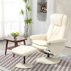 a white recliner chair and ottoman in a living room with a potted plant