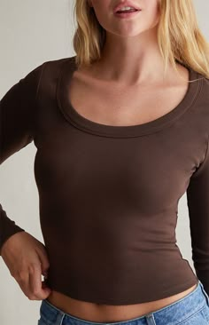 Your everyday look gets upgraded with the Serenity Scoop Long Sleeve Top from Est. PAC 1980. This comfortable top has long sleeves, a scoop neckline, and a fitted design.   	Solid color top 	Long sleeves 	Scoop neckline 	Regular fit 	Fitted 	95% cotton, 5% spandex 	Machine washable 	Model is wearing a size xsmall Long Sleeve Shirt Outfits, Brown Long Sleeve Top, Closet Redo, College Stuff, Brown Tops, School Trip, 2024 Christmas, Fire Fits, Brown Top