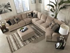 a living room with a large sectional couch