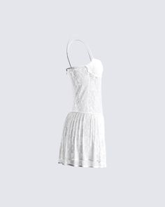 Give em' a taste of heaven in this white lace pleated dress 🤍 Made from stretchy lace, and complete with a lined bandeau bra, pleated skirt, fitted bodice, and drop waist that creates an elegant, and flowy look ✨ Leave little to the imagination -- dress is sheer & undergarments are not included 👀 Strapless Fitted Lace Dress, Fitted Strapless Lace Dress, Lace Mini Dress With Spaghetti Straps, White Corset Dress With Built-in Bra, White Lace Corset Dress With Lined Bodice, Fitted Lace Mini Dress With Lining, Fitted Lace Mini Dress With Built-in Bra, White Lace Bodice Corset Dress For Summer, Fitted Pleated Lace Dress