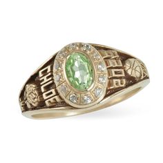 an old style ring with a green stone in the center and white diamonds around it