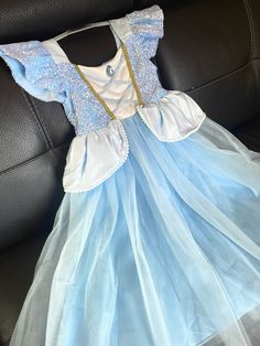 Transform your little girl into a fairytale princess with this stunning Cinderella Blue Princess Dress. Perfect for ages 2-10T, this dress features a beautiful light blue color that will make her feel like she's stepped right out of a storybook. Designed with a soft, comfortable fabric, it ensures hours of imaginative play. Ideal for birthdays, Halloween, or dress-up parties, this dress will make every occasion magical. Let her embrace the enchantment and charm of being a princess. Enhance Imagination: Spark creativity with endless storytelling and role-playing. Build Confidence: Watch her confidence soar as she takes on the role of her favorite princess. Create Memories: Perfect for photoshoots, making lasting memories of her magical moments. Comfort and Style: Designed for comfort with a Blue Princess Dress, Cinderella Blue, Being A Princess, Birthday Costume, Cinderella Princess, Cinderella Dress, Fairytale Princess, Girls Costumes, Cinderella Dresses