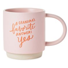 a pink coffee mug with gold lettering that says, a grandma's favorite answer yes