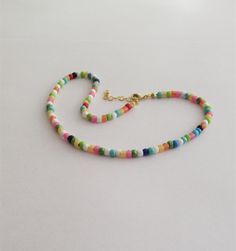 "The Dainty Colorful Beaded choker is great for summer and in the beach. It is made with small Japanese glass beads. This Beaded Choker can be perfect to wear everyday. This listing for ONE CHOKER. DETAILS - Japanese glass seed beads 4 mm - Quality strong nylon string - Choker length. Choose in the drop down menu - Lobster or round clasp closure. Available gold tone (default) or silver tone (by request) - Extension (adjustment) is 1 inch (2.5 cm). If you need longer, please, leave a note when or Summer Beaded Chain Choker As Gift, Summer Spacer Bead Choker Jewelry, Summer Beaded Choker As A Gift, Trendy Festival Beaded Chain Choker, Summer Beaded Choker As Gift, Summer Beaded Chain Choker Jewelry, Adjustable Bohemian Choker With Spacer Beads, Summer Festival Beaded Chain Choker, Summer Beaded Chain Choker