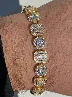 Men's 10mm wide custom link tennis bracelet  Amazing mix or round and baguette stones!     Around 31 grams as an 8"  We also have it as a 7" (if you need 7" please message us during checkout or we ship 8" as default)  15ct man-made diamonds (cant tell difference between natural diamonds without a microscope)  Super ICY you have to see to believe!!    SOLID 925 Sterling silver   14k yellow gold finish  Gold is bonded to the silver so color will last many years and wont fade!  Will Black Diamond Bracelet, Dope Jewelry Accessories, Yellow Diamonds, Engraved Pendant, Round Cushion, Diamond Tennis Bracelet, Photo Pendant, Dope Jewelry, Man Made Diamonds