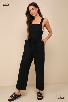 The Lulus Easygoing Summer Black Linen Straight Leg Jumpsuit makes your sunny day wardrobe a little extra fun and effortless! Lightweight, cotton-linen blend woven fabric shapes this overall-inspired jumpsuit with a square neckline supported by straps with adjustable button closures at the back. Fitted bodice and a banded waist (with elastic at the back) sit atop straight pant legs with diagonal front pockets and slightly cropped, ankle-grazing hems. A sash tie at the waist can be styled in the Rehearsal Dinner Guest Outfits, Overall Jumpsuit, Nashville Outfits, Wedding Top, Casual Wedding Dress, Summer Black, Guest Outfit, Black Linen, Straight Pants