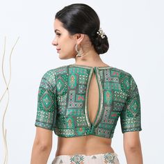 Elevate your traditional look with our Green Silk Print Saree Blouse, crafted from luxurious silk for a smooth, lustrous finish. The vibrant green hue, paired with an elegant print, adds a fresh and sophisticated touch to your saree ensemble. Featuring a classic fit and a subtle back zip closure, this blouse ensures both style and comfort. Perfect for festive occasions and special celebrations, it effortlessly enhances any saree with its rich texture and eye-catching design. Please be aware that Silk Sari Blouse Design, Back Zip Blouse Design, Key Hole Blouse Design, Saree Blouse With Collar, Printed Blouse Designs For Saree, Print Blouse Design, Sari Blouses, Simple Saree Designs, New Saree Blouse Designs