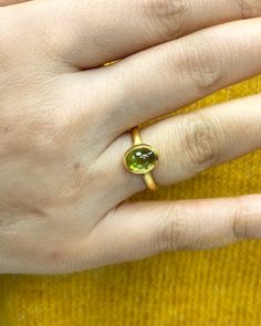 Natural Peridot Ring * Dainty Cabachon Ring * Genuine Peridot & 14K Solid Gold * Best Gift for Her/Him * Handmade Ring ◎ Details ◎ ○ Gemstone Details .Natural PERIDOT Oval Cut 9X7 mm approx. 2.01 ct ○ Gold Details 14K Solid Gold Width of Band : 2.50 mm Weight of Ring : approx 3.80 gr Made to Order HANDMADE ITEM ○ Upgrade to Solid 18K Gold, please click the link below: https://www.etsy.com/listing/962826004 For more CABACHON BEZEL rings : http://etsy.me/37fvI60 ○ PERIDOT RINGS : https://etsy. Peridot Rings, Dainty Band, Topaz Color, Peridot Stone, Bezel Ring, Best Gifts For Her, Peridot Ring, Ring Dainty, August Birth Stone