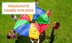 an overhead view of people playing with kites and confetti on the grass