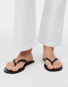 The Gabi Thong Slide Sandal in Shiny Leather Leather Toe Post Flip Flops For Beach Season, Sleek Single Toe Strap Flip Flops For Spring, Spring Sleek Flip Flops With Single Toe Strap, Sleek Spring Flip Flops With Single Toe Strap, Sleek Toe Post Flip Flops For Spring, Sleek Spring Toe Post Flip Flops, Sleek Single Toe Strap Flip Flops For Summer, Sleek Toe Post Flip Flops For Beach, Sleek Flip Flops With Single Toe Strap For Beach