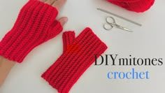 someone is making crochet mitts out of red yarn