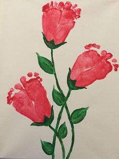 a drawing of three pink flowers with green leaves on white paper and watercolor pencils