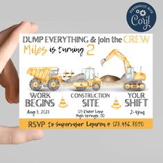 someone holding up a business card with construction vehicles on the front and back, which reads dump everything & join the crew