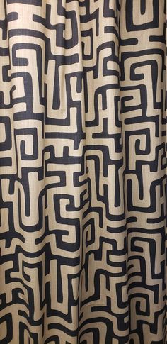 a black and white shower curtain with an abstract design