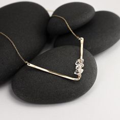 These herkimer diamond layering necklaces are just delightful - they reflect light from the gold chain, the gently hammered V pendants, and from the beautiful herkimer stones.  The stones feature the occasional imperfection and a range of variations in structure that natural stones do, and it gives them a wonderful sparkle and interest, but they are all stunning, bright stones that catch and reflect the light beautifully .  Layer these up with the simple herkimer pendant necklaces.The stones are Dainty Faceted 14k Gold Filled Necklaces, Dainty 14k Gold-filled Faceted Necklace, Dainty 14k Gold Filled Faceted Necklace, Delicate Hammered Jewelry For Everyday, Delicate Everyday Hammered Jewelry, Dainty Hand Forged 14k Gold Filled Jewelry, Dainty Hand Forged Everyday Jewelry, Everyday Hand Forged Rose Gold Jewelry, Everyday Faceted Sterling Silver Necklaces