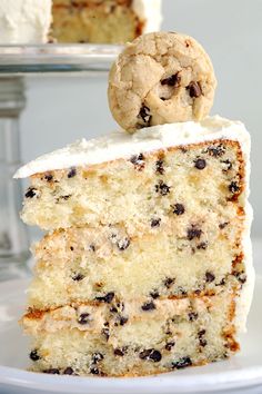 there is a piece of cake with white frosting and chocolate chips on the top