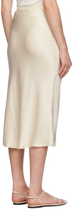 Bias-cut and double-faced silk charmeuse skirt. · High-rise · Elasticized waistband Supplier color: Beige Silk Skirt With Bias Cut And Relaxed Fit, Elegant White Silk Bottoms, Chic Silk Maxi Skirt With Satin Finish, Chic White Silk Maxi Skirt, Elegant Bias Cut Relaxed Fit Skirt, Cream Silk Flowy Skirt, Flowy Cream Silk Skirt, Elegant Cream Maxi Skirt With Relaxed Fit, Chic Silk Skirt With Satin Finish