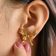 🌻These stud earrings feature a delicate butterfly design, adding a touch of whimsy and elegance to your look. 🥰This piece is meticulously crafted from S925 sterling silver(total 7.0g) and finished with a luxurious coating of genuine 18k gold plating. 🥰This earrings are adjustable to fit your desired size. 🥰We will send it in a beautiful jewelry box and package it carefully. We offer boxes in blue, green, white, and black. Please leave a message specifying your preferred color 🥰Please leave a message if you need any assistance. Thank you. Butterfly Charm Wing-shaped Earrings For Gift, Butterfly Charm Earrings As Gift, Gold Wing-shaped Earrings For Party, Elegant Gold Earrings With Butterfly Charm, Gold Wing-shaped Party Earrings, Unique Gold Wing-shaped Jewelry, Gold Butterfly Charm Earrings For Party, Gold Earrings With Butterfly Charm For Party, Handmade Gold Wing-shaped Earrings