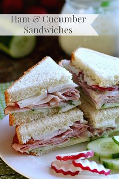 ham and cucumber sandwiches on a plate with pickles