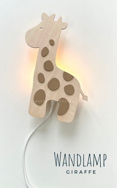 a wooden giraffe lamp is shown on a white background with the word walllamp