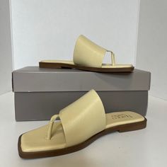 Franco Sarto Merci Sandal Size: 6.5 M Color: Lemonade (Pastel Yellow) New With Box Featuring An Angular Square Toe And Sleek Silhouette, This Minimal Leather Sandal Is A Versatile Addition To Your Warm-Weather Wardrobe. Thong Toe Slip-On Style Leather Upper, Synthetic Lining And Sole Imported Please Review All Pictures As They Are Part Of The Description- No Returns Cream Toe Post Sandals In Synthetic Material, Cream Toe Post Synthetic Sandals, Cream Sandals With Removable Insole And Single Toe Strap, Cream Toe Post Sandals For Spring, Yellow Medium Width Sandals For Summer, Yellow Synthetic Toe Post Sandals, Spring Cream Toe Post Sandals, Yellow Closed Toe Sandals Medium Width, Chic Yellow Slip-on Sandals