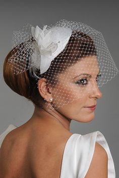 This is a handmade ivory wedding fascinator mini hat with soft floral leaves, a hair comb, and a birdcage netting veil. It is available in off-white color, which goes with common wedding dress colors. They look great with contemporary dresses, particular shorter ones. It is made in a standard one-size, and it has a hair comb under it, so it can be worn easily without the support of a hairdresser. It will be carefully packed, and returns are accepted for products with labels. Other models are ava Adjustable White Headpiece For Wedding, Adjustable Fascinator For Wedding, Wedding Mini Hat With Pinched Crown, Adjustable Wedding Fascinator, Adjustable White Wedding Hat, White Pinched Crown Hat For Wedding, White Wedding Costume Hat With Pinched Crown, White Wedding Hat With Pinched Crown, Adjustable Pinched Crown Hat For Wedding