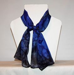 This long silk scarf measures 11 by 46 inches or 28 by 114 centimeters. It will go once around the neck and tie. It looks smart with a shirt or a low neck sweater. The edges are hand rolled and hand stitched. I sew my own label into the edges. I  used steam fix dyes on ponge 5 silk. Ponge 5 is soft ,light and drapes well. I sprayed black and dark blue steam fix dyes and whilst the dye was wet I placed salt onto it. When heat is applied the salt pulls the dye into a unique pattern. When dry the s Classic Silk Scarf As A Gift, Elegant Rectangular Silk Scarf For Gifts, Elegant Rectangular Silk Scarf For Gift, Elegant Rectangular Silk Scarf As Gift, Elegant Rectangular Silk Scarf Gift, Classic Silk Scarves As A Gift, Classic Silk Scarves For Gift, Black Silk Scarves As A Gift, Black Silk Scarf For Gift