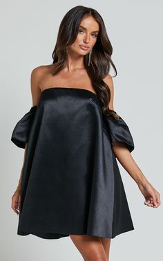 Turn heads and steal the show in our Rhaella Mini Dress! This playful off-the-shoulder dress features puff sleeves and a structured A-line silhouette that is perfect for any party night. Made from high-quality polyester, this black mini dress is both comfortable and stylish. Whether you're hitting the dance floor or going out for cocktails with friends, the Rhaella Mini Dress will have you feeling confident and flirty all night long. So go ahead, rock that 3/4 sleeve look and make a statement wh Structured Mini Dress, Off Shoulder Puff Sleeve, Shoulder Puff Sleeve, Feeling Confident, Black Mini Dress, Dress Silhouette, The Dance, Party Night, Dance Floor