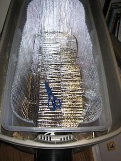 a large metal container sitting on top of a wooden floor