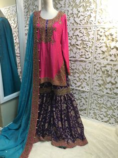 This is intricatley hand embroideried pure rawsilk shirt with dull gold dabka work, paired with traditional jamawar gharara and contrast chiffon dupatta with detailed embroidery. Colors can also be changed. Size: This is made to order, so customer should provide their measurements. I can provide a custom form It will take 4-6 weeks to make this outfit (urgent orders can also be placed, please message me to check) Shipping: vis DHL Dress will be exactly as shown Designer Wear Dola Silk Sharara With Zari Work, Gold Silk Palazzo Set With Intricate Embroidery, Eid Anarkali Style Raw Silk Sharara, Anarkali Style Raw Silk Sharara For Eid, Designer Wear Raw Silk Sharara With Traditional Drape, Designer Wear Traditional Drape Sharara In Raw Silk, Semi-stitched Raw Silk Sharara With Zari Work, Designer Raw Silk Sharara With Resham Embroidery, Designer Wear Sharara With Resham Embroidery In Raw Silk