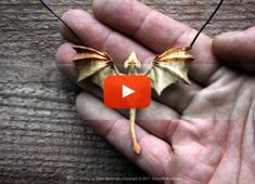 a person holding a small bat in their hand with the caption, how do bats fly?