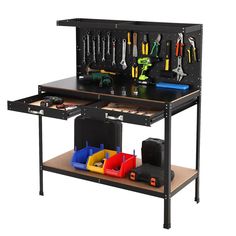 a black workbench with tools on it and various items in bins underneath