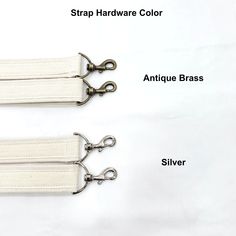 two white zippers with metal handles on each side and the other side labeled strap hardware color antique brass, silver, and antique brass