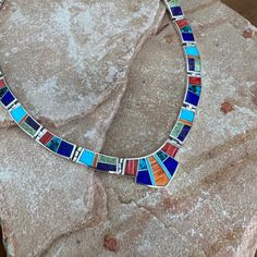 This gorgeous Sterling Silver Necklace is shown in the Indian Summer Collection, features Red & Orange Spiny, Sugilite, Gaspiete, AZ Blue Turquoise, Lapis & Tibetan Turquoise. Dimensions: 19" Total Length; Centerpiece Link: 1 3/8"W x 3/4"H Link Size: 7/8" x 5/16" They are designed by David Rosales, one of the finest contemporary Southwest Artists in the world. He is the founder and co-owner of Supersmiths, Inc. of Gallup, NM. This Handcrafted Necklace is custom made and carries a lifetime guaran Buffalo Jewelry, Contemporary Southwest, Spiny Oyster Jewelry, Lapis Jewelry, Black Arrow, Silver Belt Buckle, Tibetan Turquoise, Southwest Jewelry, Indian Summer