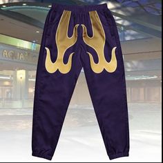 PREPARE YOURSELF! Inspired by the iconic tracksuit, unleash your inner fighter with our Flamin' Track Pants! Whether you're hitting the streets or warming up for a match, these joggers will keep you looking cool and confident. Get yours now and channel the legendary fighter in style!  Style with our flame design windbreaker for a complete outfit! * 100% polyester * Fabric weight: 2.21 oz/yd² (75 g/m²) * Lightweight, water-resistant fabric * Fully lined, mesh lining  * Relaxed fit * Elastic waist Hip Hop Joggers For Sports With Relaxed Fit, Hip Hop Style Relaxed Fit Sweatpants For Sports, Sportswear Tracksuit With Elastic Waistband For Streetwear, Sportswear Activewear With Elastic Waistband For Streetwear, Relaxed Fit Tracksuit For Streetwear Athleisure, Hip Hop Style Sweatpants For Streetwear With Elastic Waistband, Hip Hop Style Sweatpants For Sports, Hip Hop Style Sweatpants For Streetwear, Hip Hop Style Sweatpants With Elastic Waistband For Jogging