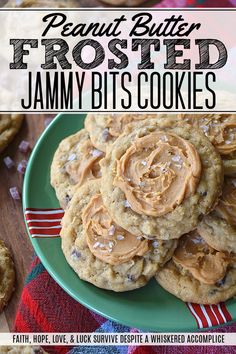 peanut butter frosted jammy bits cookies on a green plate with red and white striped napkin