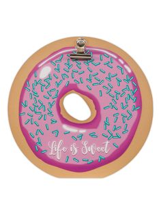 a pink donut with sprinkles on it that says life is sweet