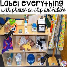 a baby laying on top of a wooden shelf next to toys and other items in a playroom