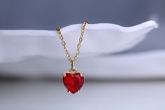 Gold filled red ruby heart stud charm pendant necklace with matching earring option Dainty minimalistic red heart tiny charm necklace High quality 18k gold plated  With adjustable chain - Length option of 14'' to 16'' ,or 16'' to 18''  chain. Dainty minimalistic pendant charm. Great as a gift ,or for yourself for that special occasion! Any questions feel free to ask! Thanks for supporting a small family run business! Comes packaged in a beautiful box ready to gift! Ruby Pendant Jewelry For Valentine's Day, Red Ruby Jewelry Gift For Her, Fine Ruby Heart Jewelry, Heart-shaped Ruby Jewelry For Valentine's Day, Fine Ruby Heart-shaped Jewelry, Heart-shaped Ruby Birthstone Jewelry, Ruby Heart Charm Jewelry, Ruby Heart Charm Necklace For Anniversary, Ruby Heart Pendant For Valentine's Day