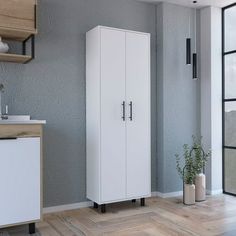 a white cabinet sitting in the corner of a room