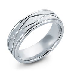 This wedding band is 7mm in width. It has a combination of sand finish in the center and high polish on the edges. In the center there is also a beautiful engraved eternity design. Modern Engraved Thick Band Ring For Wedding, Modern Engraved Ring With Thick Band For Wedding, Modern Engraved Thick Band Wedding Ring, Modern Engraved Wedding Ring With Thick Band, Modern Wedding Bands With Diamond Cut, Modern Diamond Cut Wedding Band, Modern Wedding Ring With Round Diamond Cut Band, Elegant White Gold Rings With Brushed Finish, Elegant Wedding Rings With Brushed Finish