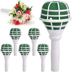 six green and white decorative garden stakers with flowers in the center, set of 6