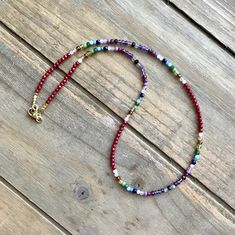 A colorful multi gemstone necklace that is as bright and beautiful as it is versatile. A convertible multi wrap stacking bracelet and layering necklace, it can be worn as a bracelet - wrapping around the wrist 3 times one day and as a necklace the next - with or without other layering necklaces. Perfect as a #Christmasgift - or for Valentine's - or a #birthdaygiftforher - or an #anniversarygift, if she likes sparkles, she'll LOVE this! Gemstones include: Red coral  Rainbow Moonstone Citrine Hessonite Garnet Peridot Canadian Jade Green Crystal Aquamarine Apatite Sapphire Rose Quartz Chariote Garnet Ruby Amethyst Labradorite Black Spinel Gold plated hematite cubes begin and end this #amazingtechnicolordreamcoat - I mean amazing technicolor convertible wrap bracelet/necklace. All findings are Multicolor Multi-strand Wrap Bracelet With Colorful Beads, Multicolor Gemstone Beaded Necklaces For Layering, Multicolor Beaded Necklace With Gemstone Beads For Layering, Multicolor Natural Stones Necklaces For Layering, Layering Multicolor Necklaces With Natural Stones, Multicolor Wrap Bracelet With Round Beads And Natural Stones, Multicolor Lariat Necklace With Gemstone Beads, Red Gemstone Beaded Bracelet Bohemian Style, Multicolor Gemstone Beads Lariat Necklace