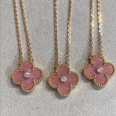 This Clover Rhodonite Necklace features a stunning diamond set in a luxurious pink gold setting. The unique design is both elegant and eye-catching, making it the perfect accessory for any occasion. Crafted with precision and showcasing the healing properties of rhodonite, this necklace adds sophistication and positive energy to any outfit. ADDITIONAL INFORMATION Color: Pink Gold Stone: Cubic Zirconia, Rhodonite Material:925 Sterling Silver - 18k Gold Plated- 18k Real Gold ( contact us via insta Sweet Alhambra Necklace, Rhodonite Necklace, Thigh Jewelry, Simplistic Jewelry, Alhambra Necklace, Pink Gold Necklace, Van Cleef And Arpels Jewelry, Detailed Jewelry, Jewelry Accessories Ideas