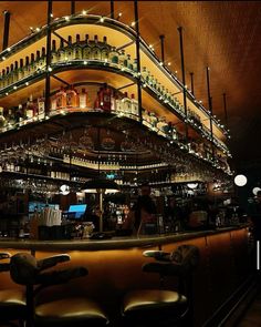 a bar with lots of bottles on the shelves