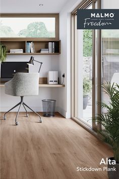 a home office with wood flooring and glass doors leading to the outside patio area