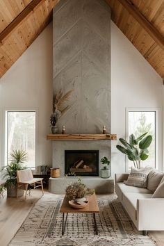 a living room filled with furniture and a fire place in the middle of a room