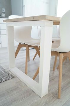 a white table and chairs in a room